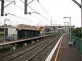 Lysaghts railway station, in Australia, with two side platforms, and a footbridge connecting them.