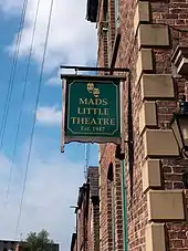 Hanging sign MADS on Georgian style building