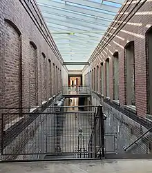 Atrium between two brick buildings.