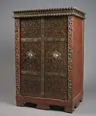 18th century cabinet, lacquer and gilding on wood, iron. The decoration includes skulls and skeletons.
