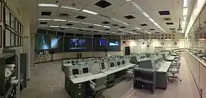 Mission Operation Control Room 2 in the Christopher C. Kraft Jr. Mission Control Center, looking across the consoles from the corner of the room (prior to the 2019 restoration)