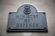 The Ministry of Defence plaque outside the south door of Main Building.