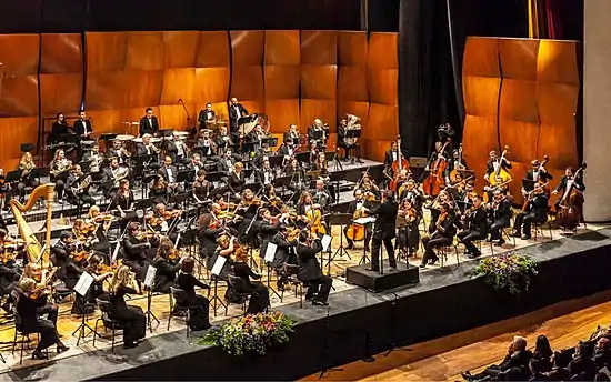 MPO musicians in full ranks during a classical music performance event.