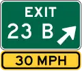 Exit number sign with speed advisory