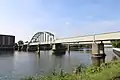 Train bridge over the river Maas in Maastricht on the railway to Hasselt