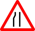 Road narrows on the left