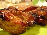 BBQ pork (叉燒) is a popular delicacy, with many variants in Cantonese cuisine.