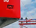 Breaking the champagne bottle on the bow of USCGC Mackinaw on launch day, April 2, 2005.