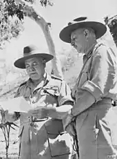 Two soldiers in khaki uniforms and slouch hats