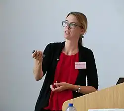 Lancaster speaking at "Ahead of the Curve: Women Scientists at the LMB" symposium at the MRC Laboratory of Molecular Biology in November 2022