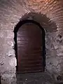 Late-medieval archway of Christian Walls in a restaurant basement at number 3 of Plaza de Isabel II