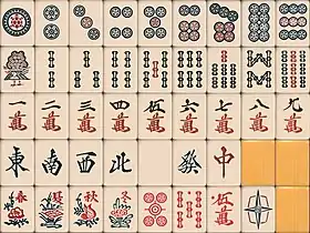 Another Japan style, no different when we turn the bamboos upside down. There is a blind spot on the red five tiles. The dora white dragon is designed as Kyūshū style. Made by Nintendo, the 1 circles features a subtle turtle design, and the red 5 circles a crosshair design.  8 flower tiles version is present.