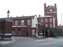 Main gate, guardroom, offices and clock tower