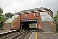 The booking office and footbridge, viewed from the platform.