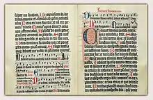 Opening from the Mainz Psalter, printed in 1457, with small printed and large drawn initials.