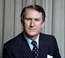 Colour portrait photo of a man wearing a suit