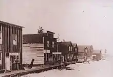 Image of wooden commercial buildings in winter.