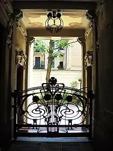 Entrance of Casa Guazzoni in Milan by Giovanni Battista Bossi (1904–1906)