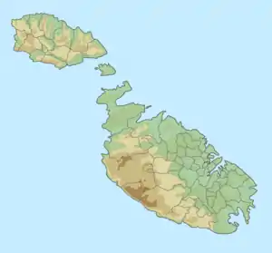 Map of the Maltese archipelago with a red dot on the south east coast of the island of Malta showing the location of St Thomas' Bay.