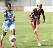 Manisha Kalyan with an opponent player.