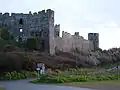 The postern gate (centre left) is in the curtain wall beneath the castle towers