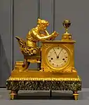 Mantel clock called The Reader; by Jean-Andre Reiche; circa 1810; matte and polished gilt bronze and "Vert de Mer" marble; 31 x 15 x 26 cm; Montreal Museum of Fine Arts (Montreal, Canada)