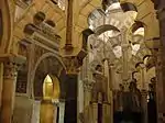 The interlacing arches in the Great Mosque of Cordoba, in Spain, dating from the 10th century and believed by some scholars to be the origin of the sebka motif