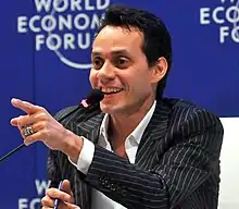 A man sitting at press conference.