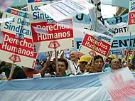 Image 45Union members march in Argentina on Human Rights Day in December 2005.  The signs read "Worker rights are human rights..