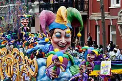Doubloons are thrown from Mardi Gras floats such as this one