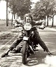Maria von Hammerstein riding a motorcycle