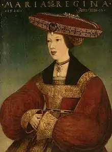 Woman wearing a dark brown dress and a tan head covering