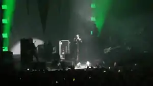 Marilyn Manson performing in 2017. From left to right: Paul Wiley, Tyler Bates, Manson, Daniel Fox and Twiggy Ramirez (Gil Sharone obscured at the drums)