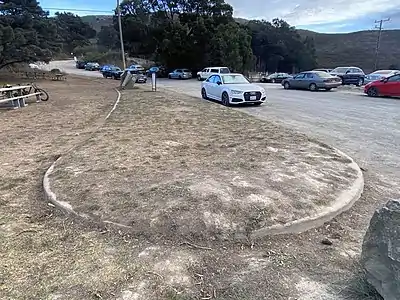 The original median and curb from Marincello Boulevard still remains.