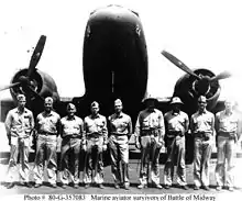Naval aviator survivors from the Battle of Midway in 1942. Several aviators on the right are wearing fiber helmets.