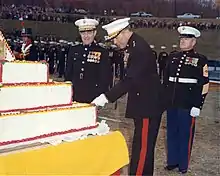 Marine Corps Birthday 1969, Marine Corps Development and Educational Center Quantico, Commanding general Lewis J. Fields cutting the cake and Commandant of the Marine Corps, Wallace M. Greene (on the left) looks on.