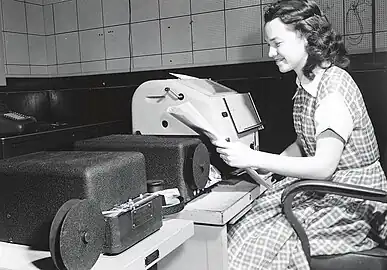 Marjory Jones (Devaney), a mathematician and programmer, is shown here in 1952, punching a program onto paper tape to be loaded into the MANIAC.
