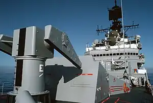 USS Worden showing the Mk 10 GMLS. Note the launcher at left, the blast doors behind launcher where the missiles exit the launcher feeder and AN/SPG-55 radars at middle right.