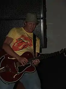 Bryan performing with Cowboy Mouth in 2004