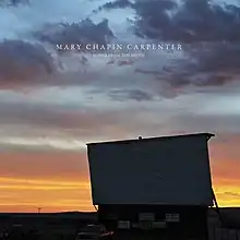 A drive-in movie screen at dusk