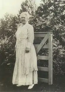 Mary Lee Ware by farm gate