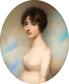 oval-shaped portrait of a thin, white, young woman with dark hair