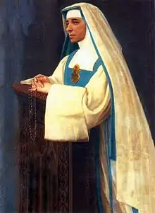 The religious habit of the Sisters of Mary Reparatrix is white, with a blue scapular, a white and blue veil and a large golden heart on the breast