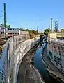 After crossing to the north of Lambert Ave in Palo Alto, Matadero Creek makes a turn to the southeast along the Caltrain tracks before crossing under them.