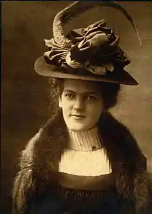 Maud Jones Horner, wearing a large hat and fur shawl, posed for a photo. Maud Jones Horner was a founding member and first president of ZTA.