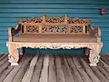 Wooden bench on covered porch