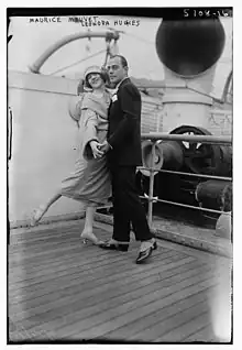 A woman and a man in a dance pose together, on the deck of a ship, in the 1920s