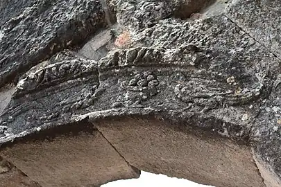 Color photograph of a carved stone arch.