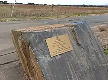 Stone monument with brass plaque