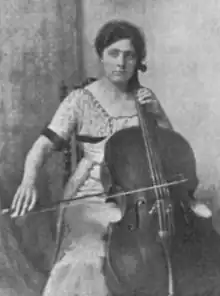 Woman, seated, playing cello, from a 1919 publication.